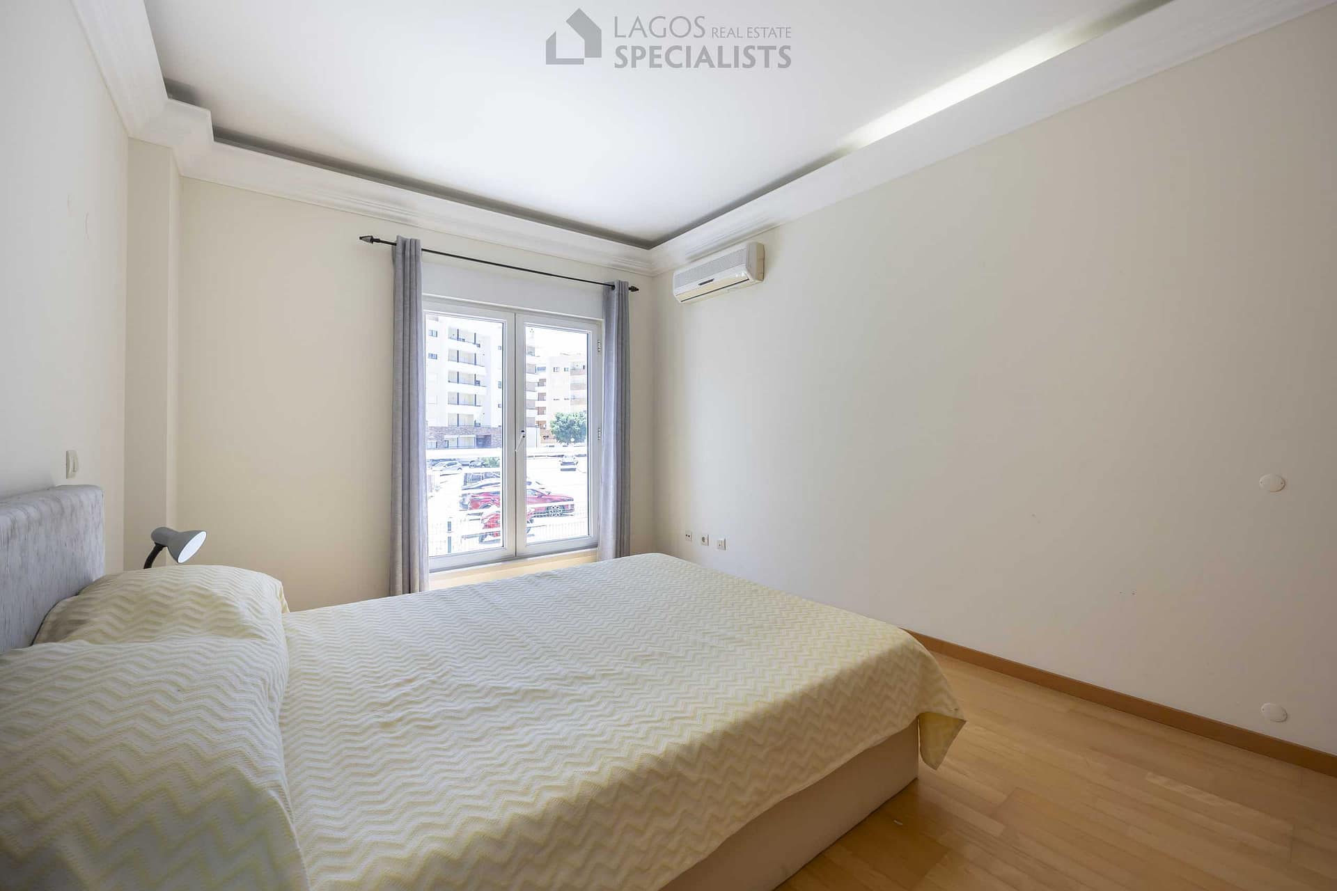 Double bedroom with built-in wardrobe and natural light