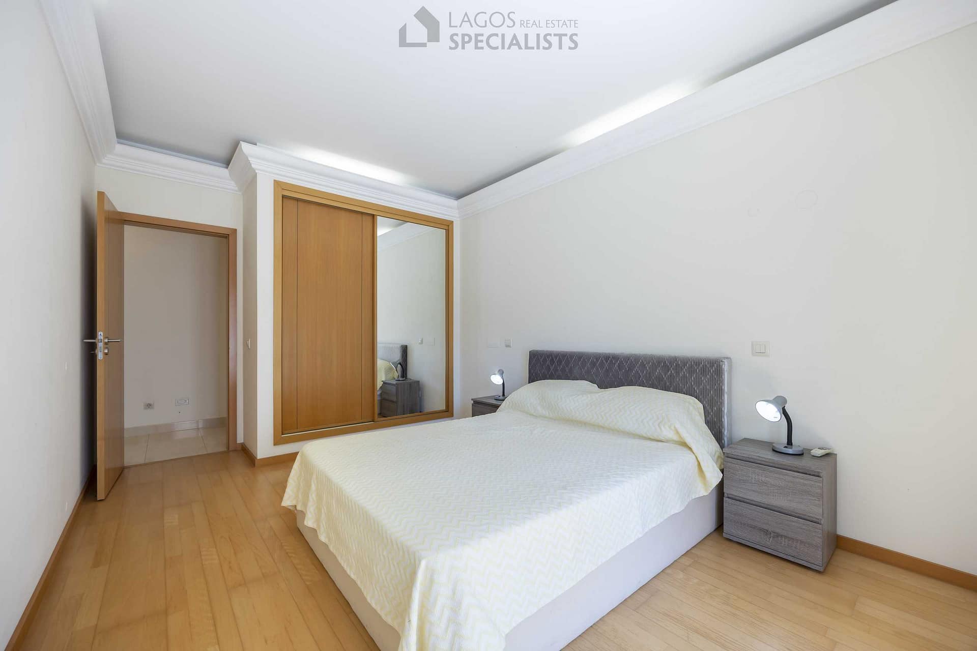 Double bedroom with built-in wardrobe and natural light