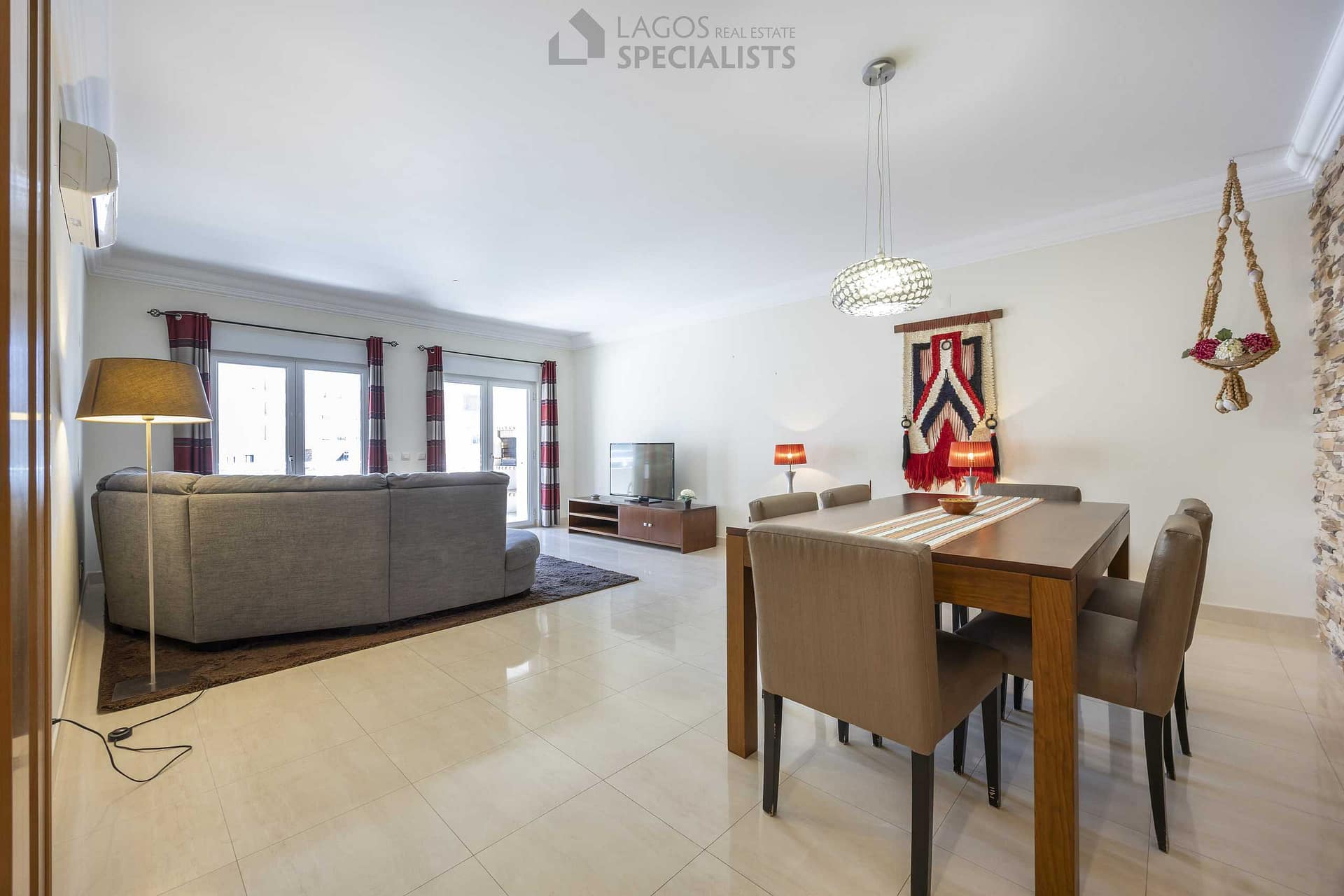 Bright living and dining room with direct access to terrace – 3-bedroom apartment in central Lagos