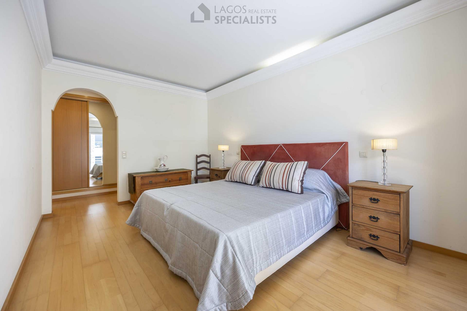 Spacious master bedroom with built-in wardrobe and en-suite bathroom