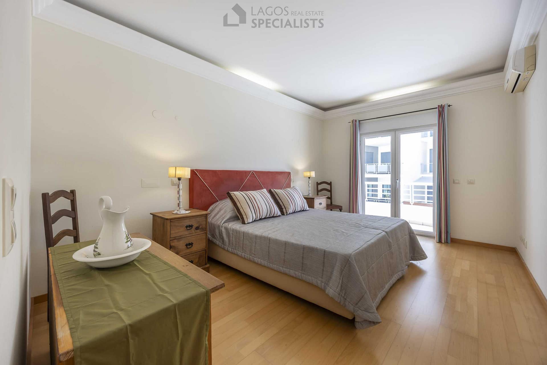 Spacious master bedroom with built-in wardrobe and en-suite bathroom