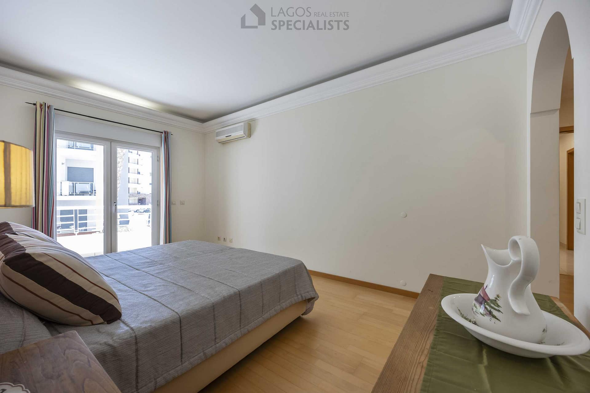 Spacious master bedroom with built-in wardrobe and en-suite bathroom