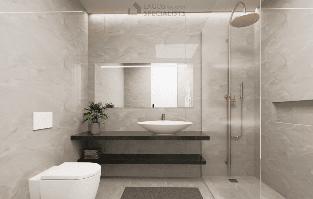 sleek bathroom with suspended fittings and walk-in shower in new build apartment Lagos