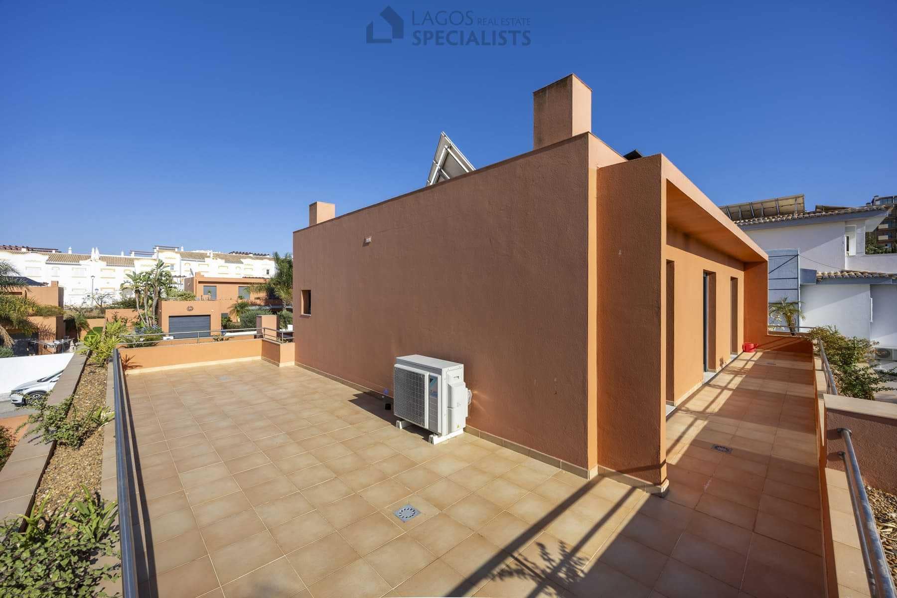 Spacious upper terrace with terracotta walls, Lagos villa
