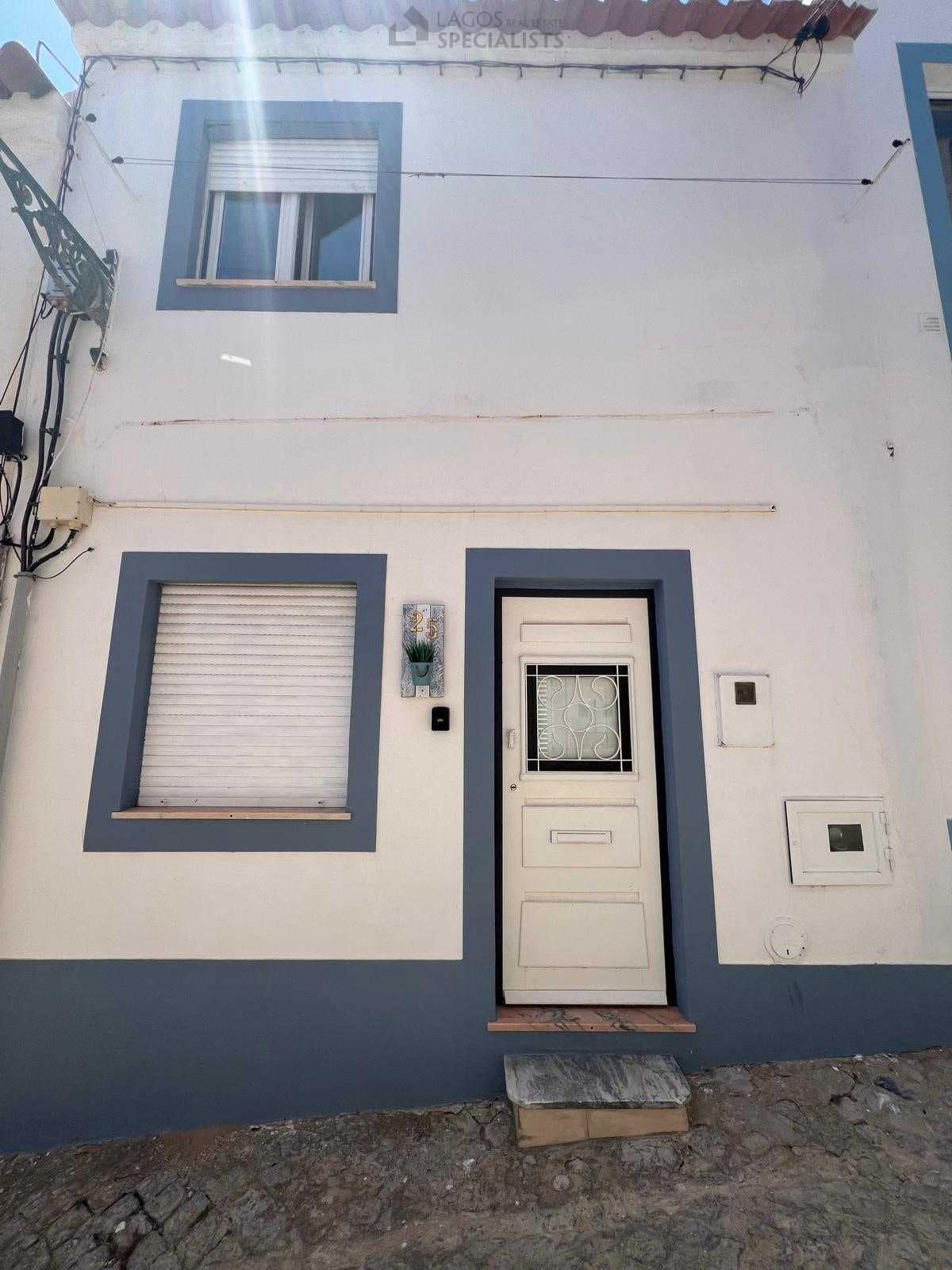 White and blue facade of traditional house in Lagos historic centre