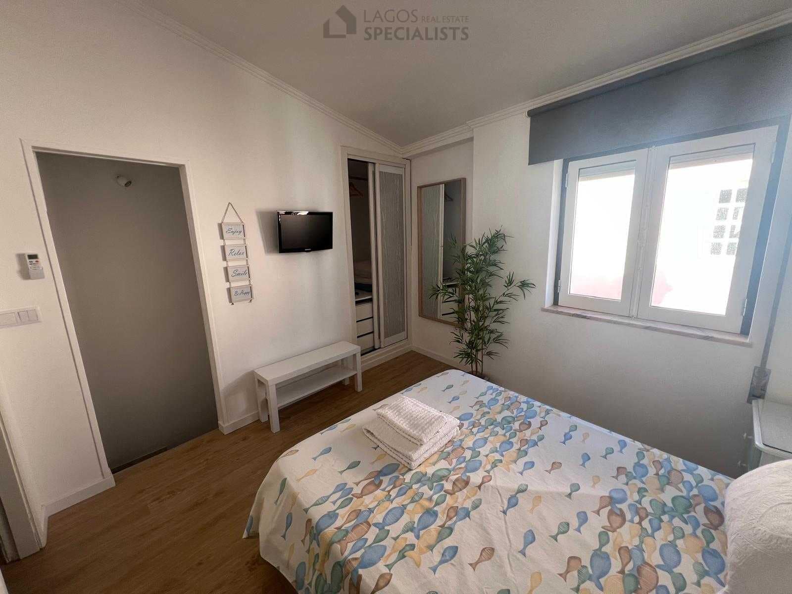 Cozy master bedroom with natural light and coastal decor – Lagos property for sale